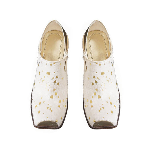 Pair of white shoes with gold speckles on a white background