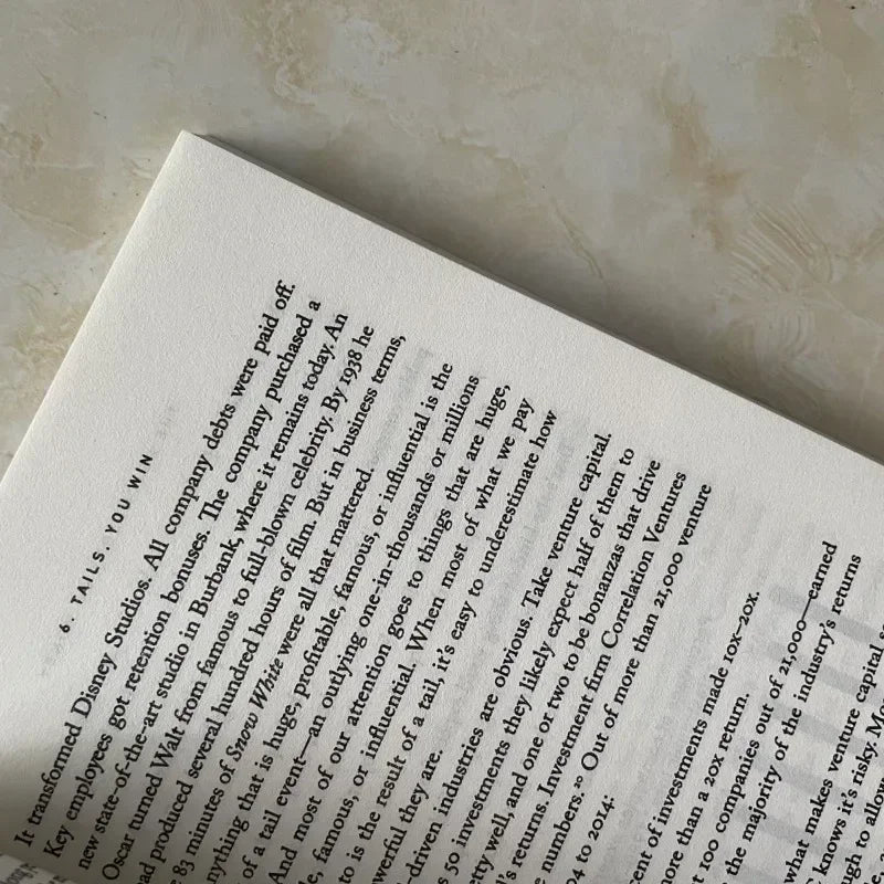 Open book with text on a textured surface