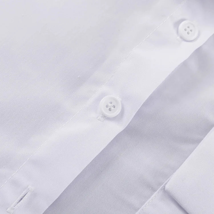 Close-up of a white shirt with buttons on a white background