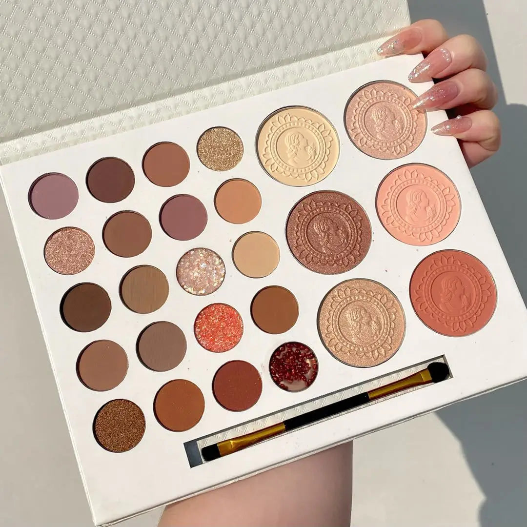 Makeup palette with various shades of eyeshadows and a brush on a white background Autumn Shades Trendy Waterproof