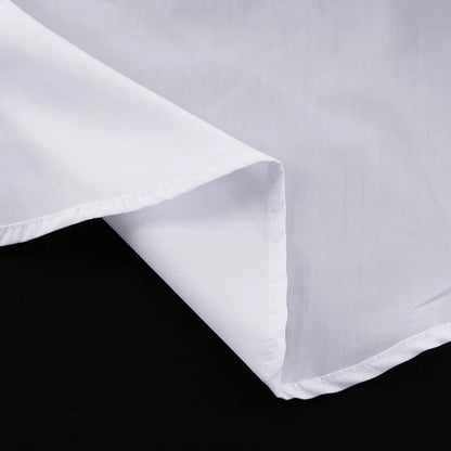 Close-up of a white fabric with a subtle pattern on a black background