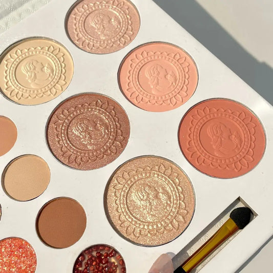 Makeup palette with various shades of eyeshadows and a brush on a white background Autumn Shades Trendy Waterproof
